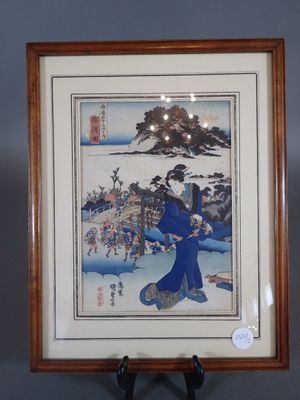 an image of a framed picture of a woman in a blue kimono