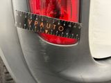 a measuring tape on the back of a car ' s tail light