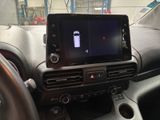 a picture of a car dashboard with a cell phone in it