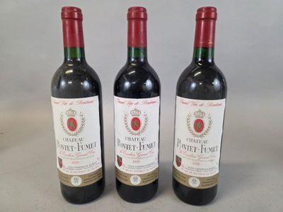 three bottles of wine sitting on top of a table next to each other