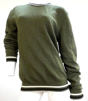 an image of a mannequin mannequin wearing a green sweater and white pants