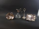 three silver objects sitting on a table next to each other
