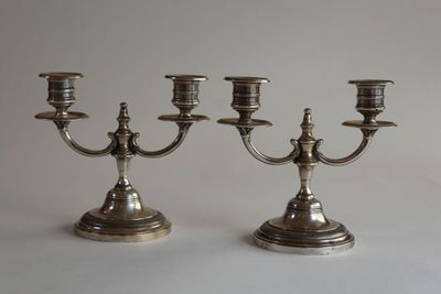 pair of silver plated candelabs with candlesticks on stands