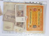 a picture of a collection of foreign currency on a table