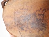 a large wooden vase with writing on it
