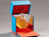 a bottle of perfume sitting inside of a blue box