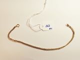 a gold chain with a tag attached to it