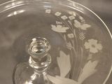a glass plate with a design on it on a table
