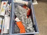two bins filled with assorted items sitting on the floor
