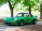 a green car that is parked on the side of the road