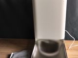 a white box with a tea bag in it on a table