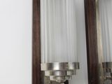 pair of mid century wall sconces in the style of a pair of sconces