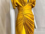 a yellow dress on a mannequin mannequin mannequin mannequin mannequin mann