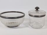 pair of glass bowls with lids and a lid on a white background