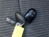 a car key with a yellow tag attached to it