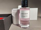 a bottle of perfume sitting on a table next to a box