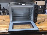 a microwave that is sitting on a table in a room