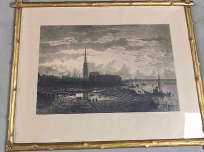 tableau encadré représentant une vue de ville avec une église en arrière-plan