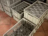 many plastic containers that are sitting on the floor