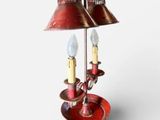 two lamps that are sitting on a stand on a table