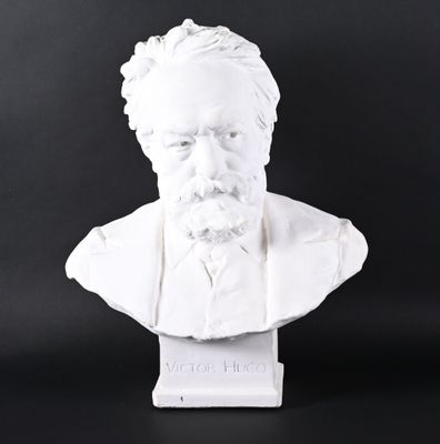 white marble bust of a man with a beard on a black background