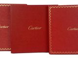 three red books with gold trims and gold lettering on them