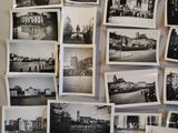 many black and white photos hanging on the wall