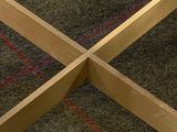 a close up of a wooden cross on the floor