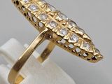 a close up of a gold ring with diamonds on it