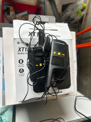 two walkie talkies that are sitting on top of a box