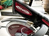 a red and black motorcycle parked in a garage
