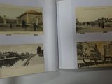 a person holding an open book with pictures on it