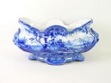 a blue and white bowl with a design on it