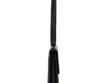 a black pen with a gold tip on a white background