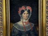 a painting of a woman in a black dress with a red bow