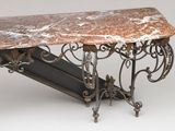 a marble top table with a shelf underneath it