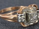 an image of a diamond ring on a black surface