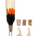 an image of a feather and some other items on a white surface