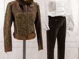 two mannequins with jackets on display in a room