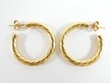 gold twisted hoop earrings on a white background