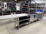 an image of a kitchen area with a table and shelves