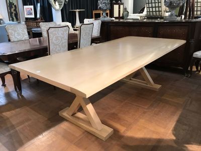 an image of a dining room table with chairs and a mirror