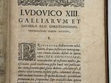 an open book with a picture of a man on it