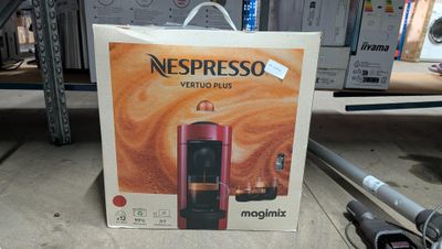 a box of nespresso coffee on the ground