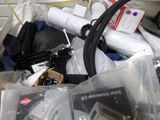 a pile of assorted electronics in a plastic bag