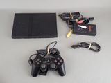 a video game console and a game controller on a table