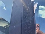a car with bullet holes in the window of it