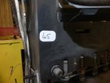 a picture of a machine that is sitting in a garage