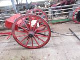 a red wagon that is sitting on the side of the road