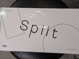 a white box with the word spirit on it sitting on a black chair